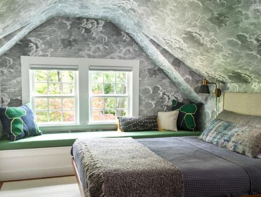 Bedroom with ceiling wallpaper based on a Moroccan tile roof